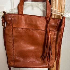 Margot New York leather crossbody handle tassel cognac color purse.
